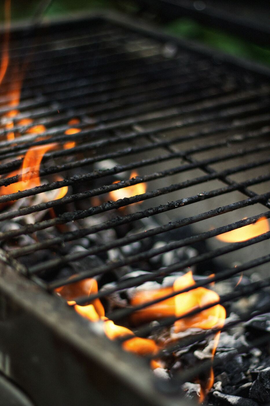 Flames under a charcoal grill