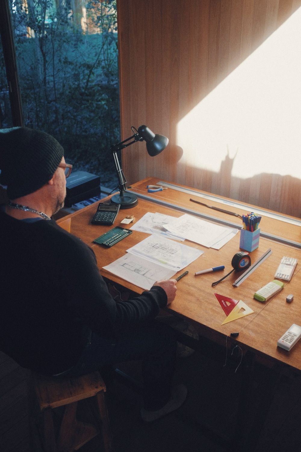 Drawing table lit by a window in the afternoon